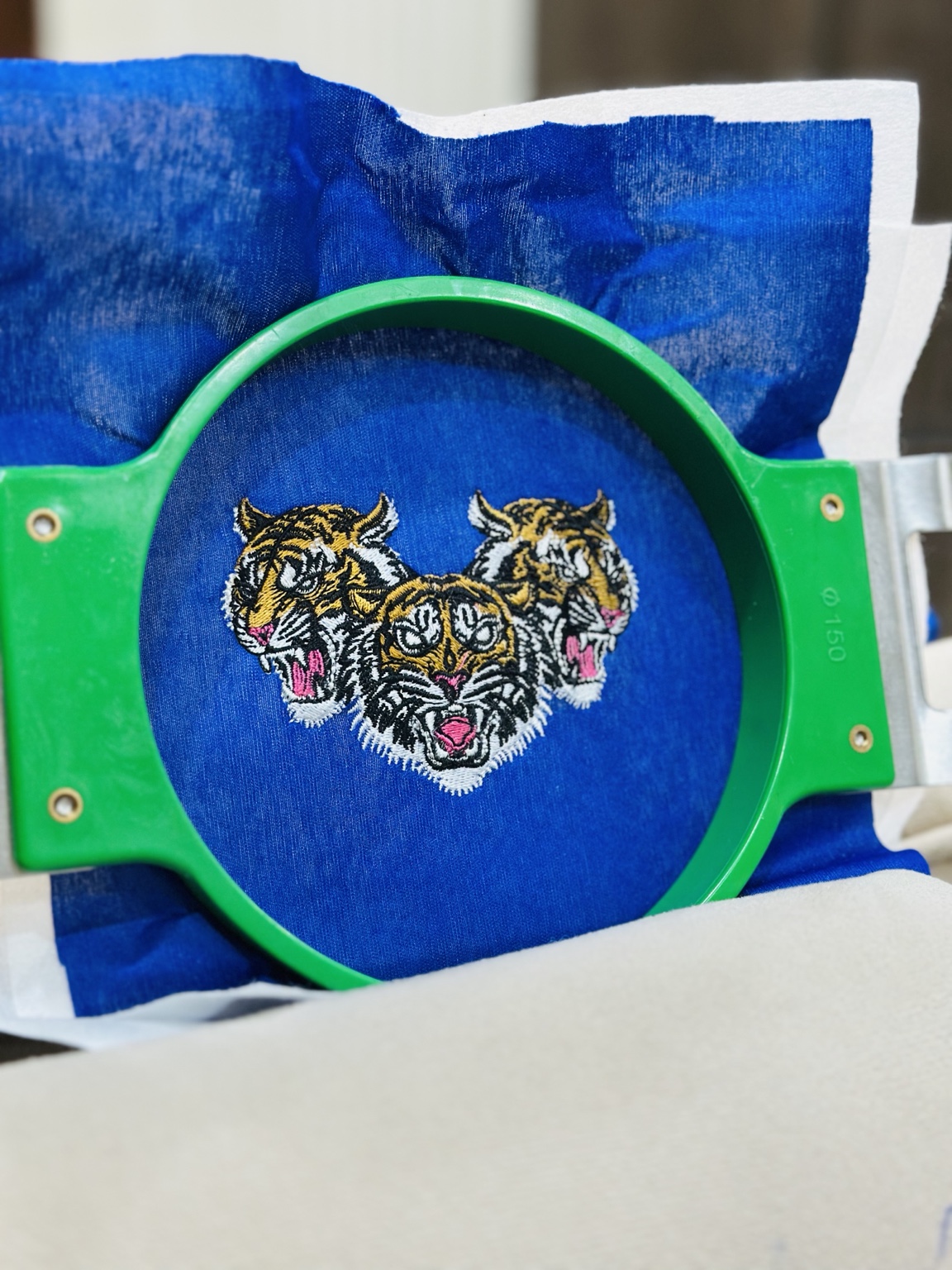 After sample embroidered tiger design